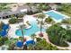 Aerial view features a resort-style pool, spa, and seating areas surrounded by lush landscaping at 20039 Heritage Point Dr, Tampa, FL 33647