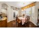 Elegant dining room featuring a chandelier, table set for six, and a view to an adjacent office at 20039 Heritage Point Dr, Tampa, FL 33647