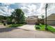 Inviting home exterior featuring a spacious driveway and lush landscaping at 20039 Heritage Point Dr, Tampa, FL 33647