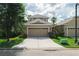 Beautiful home exterior with a wide driveway and well-maintained lawn at 20039 Heritage Point Dr, Tampa, FL 33647