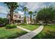 Well-maintained lawn and beautiful landscaping enhance this home's curb appeal, complete with palm trees at 20039 Heritage Point Dr, Tampa, FL 33647