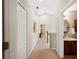 Hallway with access to bedrooms and bathroom, with a vaulted ceiling at 20039 Heritage Point Dr, Tampa, FL 33647