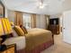 Inviting main bedroom with a plush bed, neutral walls, and window views at 20039 Heritage Point Dr, Tampa, FL 33647