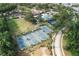 Aerial view of a community recreation area featuring tennis courts, a pool, and a clubhouse at 20039 Heritage Point Dr, Tampa, FL 33647