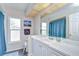 Bright bathroom features a large mirror, modern vanity, and a charming, beachy decor at 2020 Elk Spring Dr, Brandon, FL 33511