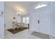 Inviting dining area with a decorative chandelier, next to the entrance, showcasing a bright and airy atmosphere at 2020 Elk Spring Dr, Brandon, FL 33511