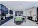 Modern kitchen featuring navy cabinetry, a large center island, and stainless steel appliances, perfect for cooking at 2020 Elk Spring Dr, Brandon, FL 33511