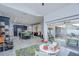 Open-concept living space that includes a kitchen with island seating and sliding glass doors to the backyard at 2020 Elk Spring Dr, Brandon, FL 33511