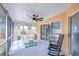 Covered patio with ceiling fan overlooks the backyard, featuring a picnic table at 2020 Elk Spring Dr, Brandon, FL 33511