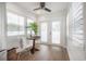 Bright sunroom featuring plantation shutters and view to the yard at 209 S Arrawana Ave, Tampa, FL 33609