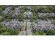 Overhead shot shows the community with lush landscaping, ample parking and well maintained buildings at 2220 Chianti Pl # 8-0828, Palm Harbor, FL 34683