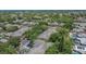 A high angle view of the community showcasing tree coverage, lush landscaping, and proximity to local amenities at 2220 Chianti Pl # 8-0828, Palm Harbor, FL 34683