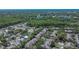 A scenic aerial view of the townhouses, lush foliage, and picturesque lake creating a serene environment at 2220 Chianti Pl # 8-0828, Palm Harbor, FL 34683