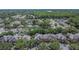 Overhead shot of well-maintained roofs amidst lush trees, highlighting the community's serene atmosphere and convenient location at 2220 Chianti Pl # 8-0828, Palm Harbor, FL 34683