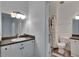 Bathroom featuring white cabinets, a neutral countertop, and a shower with a music-themed curtain at 2220 Chianti Pl # 8-0828, Palm Harbor, FL 34683