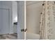 Bathroom with neutral finishes featuring a combination shower and tub and a decorative shower curtain at 2220 Chianti Pl # 8-0828, Palm Harbor, FL 34683