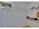 Spacious walk-in closet with wire shelving for ample storage of clothes and accessories at 2220 Chianti Pl # 8-0828, Palm Harbor, FL 34683