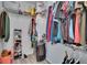 Walk-in closet featuring wire shelving and organized clothing, maximizing storage space at 2220 Chianti Pl # 8-0828, Palm Harbor, FL 34683
