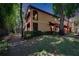 Exterior view of a multi-story building with landscaped grounds at 2220 Chianti Pl # 8-0828, Palm Harbor, FL 34683