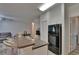 Kitchen features a breakfast bar with stainless steel stools, and black appliances at 2220 Chianti Pl # 8-0828, Palm Harbor, FL 34683