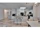 Bright kitchen features breakfast bar with modern stools and white cabinetry at 2220 Chianti Pl # 8-0828, Palm Harbor, FL 34683
