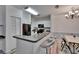 Bright kitchen with bar seating and a view of the dining area at 2220 Chianti Pl # 8-0828, Palm Harbor, FL 34683