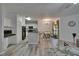 Open-concept living area boasts wood-look flooring and easy access to kitchen and dining at 2220 Chianti Pl # 8-0828, Palm Harbor, FL 34683