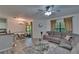 Inviting open-concept living area with wood-look flooring, a ceiling fan and recessed lighting at 2220 Chianti Pl # 8-0828, Palm Harbor, FL 34683
