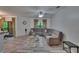 Bright living area with recessed lighting, ceiling fan, and sliding glass door to outdoor space at 2220 Chianti Pl # 8-0828, Palm Harbor, FL 34683