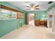 This charming bedroom boasts bright walls, wood-look floors, with an adjacent office area at 2485 Indigo Dr, Clearwater, FL 33763