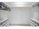 Spacious walk-in closet with built-in shelves and ample storage space for clothing and accessories at 2485 Indigo Dr, Clearwater, FL 33763