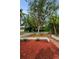 Landscaped front yard with mulch and defined garden beds enhances curb appeal at 2485 Indigo Dr, Clearwater, FL 33763
