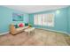 Bright living room with tile floors, large windows with shutters, and vibrant blue walls at 2485 Indigo Dr, Clearwater, FL 33763