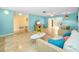 Spacious living room featuring tile floors, open floor plan, and ample natural light at 2485 Indigo Dr, Clearwater, FL 33763