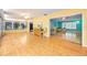 Bright living room with hardwood floors, ceiling fan, and lots of natural light at 2485 Indigo Dr, Clearwater, FL 33763