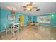 Cozy living room with bright walls, tile floors, and a dining area at 2485 Indigo Dr, Clearwater, FL 33763