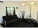 Cozy living room featuring dark curtains and unique modern lighting at 2500 Harn Blvd # A5, Clearwater, FL 33764