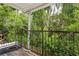 Balcony with decorative iron railing overlooking lush greenery at 2814 W Humphrey St, Tampa, FL 33614