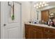Bathroom with wooden cabinets and a granite countertop at 2814 W Humphrey St, Tampa, FL 33614