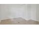 A simple bedroom with tile floors and a closet with folding doors at 2814 W Humphrey St, Tampa, FL 33614