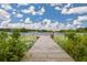 Wooden dock stretching out into a lily pad covered lake at 2814 W Humphrey St, Tampa, FL 33614