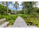 View from dock shows house and lake with lily pads at 2814 W Humphrey St, Tampa, FL 33614