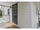 Exterior angle view of home featuring a gray door and exterior wall at 2814 W Humphrey St, Tampa, FL 33614
