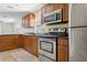 Kitchen with granite countertops and stainless-steel appliances at 2814 W Humphrey St, Tampa, FL 33614