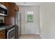 Kitchen with stainless-steel fridge and door to exterior at 2814 W Humphrey St, Tampa, FL 33614