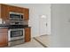 This kitchen features stainless steel appliances, updated cabinetry, and upgraded countertops at 2814 W Humphrey St, Tampa, FL 33614
