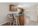 Kitchen with wooden cabinets and bar-style seating at 2814 W Humphrey St, Tampa, FL 33614