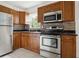 Renovated kitchen features stainless steel appliances, and upgraded cabinetry, with modern finishes at 2814 W Humphrey St, Tampa, FL 33614