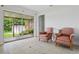 Well-lit seating area with sliding glass door access to fenced-in patio and backyard at 2814 W Humphrey St, Tampa, FL 33614