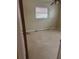 Bedroom with window, ceiling fan, and visible flooring at 2817 Miriam S St, Gulfport, FL 33711